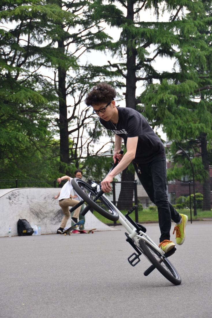 Atushi, BMX shop owner and rider, shreds on the back wheel! Komawaza Park. 
